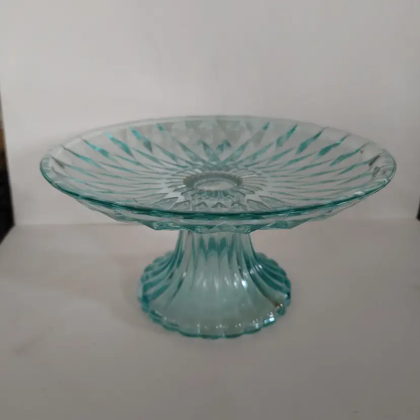 Vintage aqua blue glass pedestal cake stand with diamond pattern. 8 inch diameter. 4 inches high. No chips or cracks.