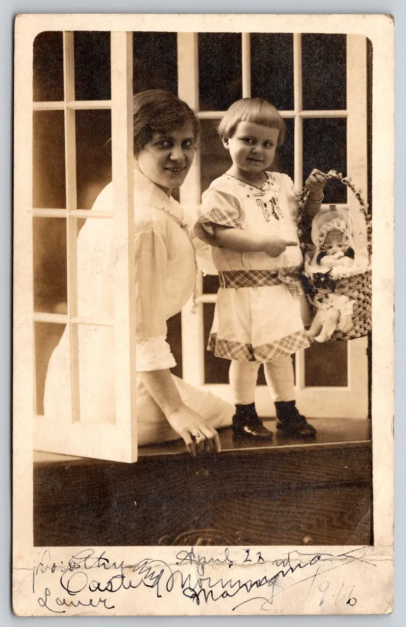Postcard RPPC Mother and Girl Pointing at a Doll in a Handbasket Real Photo - 9041