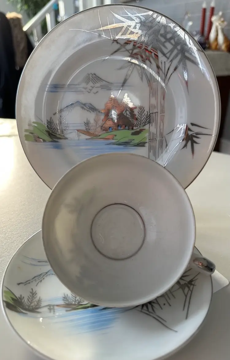 Tea Cup And Saucer And Side Plate