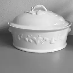 Philippe Deshoulieres oval covered casserole dish in the "California Blanc de Blanc" pattern.
