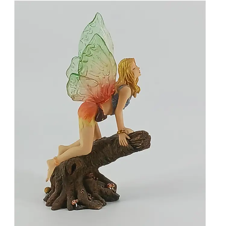 #01 Fairy kneeling on a tree trunk
