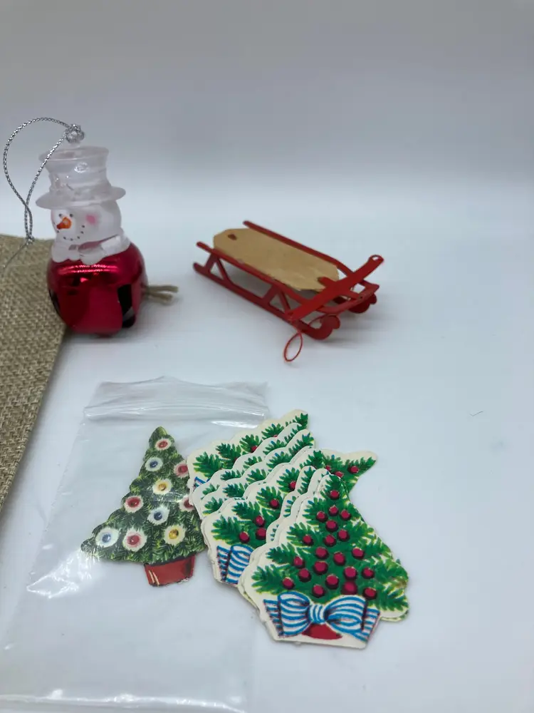 Sack of goodies: Snowman cork, snowman bell, Vintage Christmas Tree Stickers, Small Sled, and decor Bag