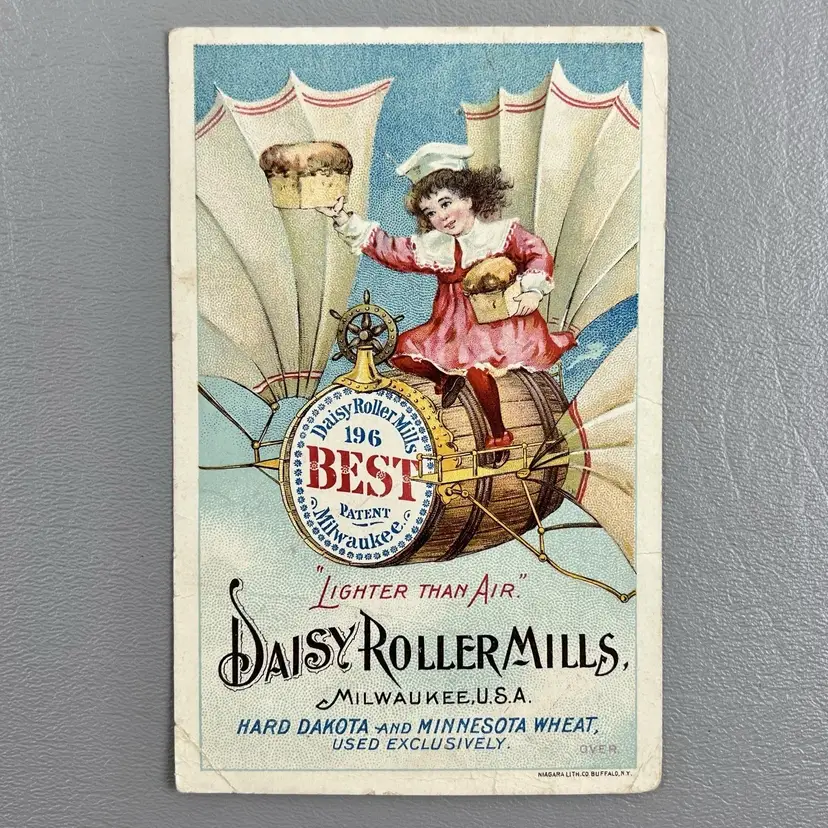 Victorian Trade Card Daisy Roller Mills Milwaukee WJ Convery Herkimer NY 5.5x3.5" Child On Flying Barrel ER Steele & Son