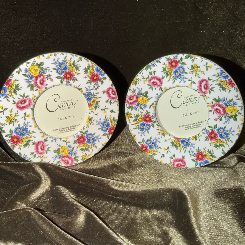 Circular white ceramic picture frame from Burnes of Boston featuring a "Chintz Julia" floral pattern