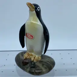 Shiken Bone China miniature penguin figurine standing on a rock
