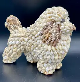Vintage shell-encrusted poodle dog figurine.