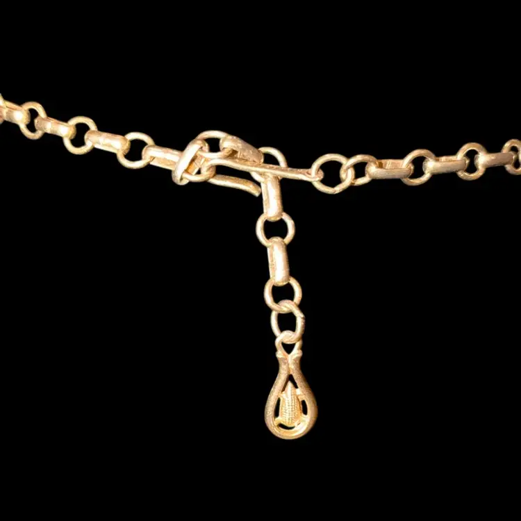 Vintage Coro gold-tone necklace with leaf motifs and clear rhinestones.