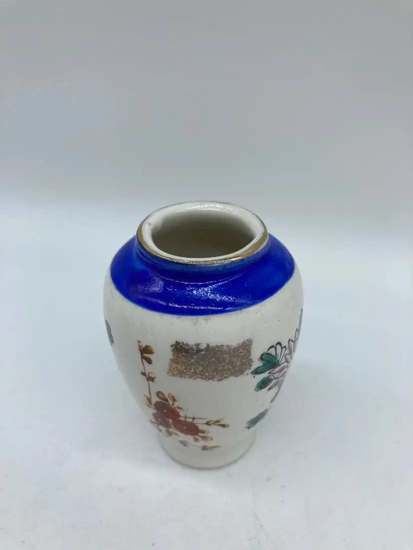 hand-painted Japanese vase with vibrant blue top band