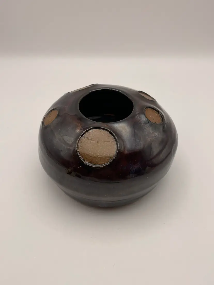 Handmade, round, brownish purple with blue, drip glaze pottery vase. Would be great with a small floral frog inside! Very different! Well made!