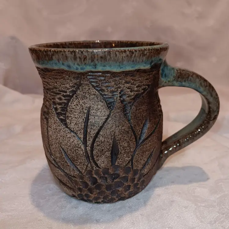 Art Pottery Mug With Carved Wildflower Design