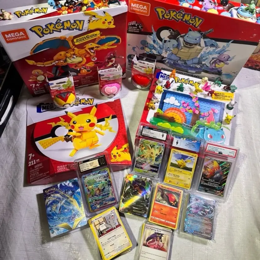 POKEMON 4 graded slabs, stacks of cards, multiple foils, one owner SEALED mega sets lots of figures all in great condition