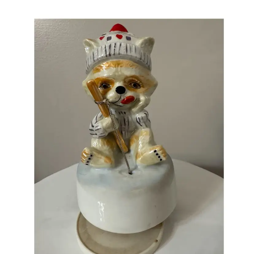 Vintage ice fishing raccoon music box