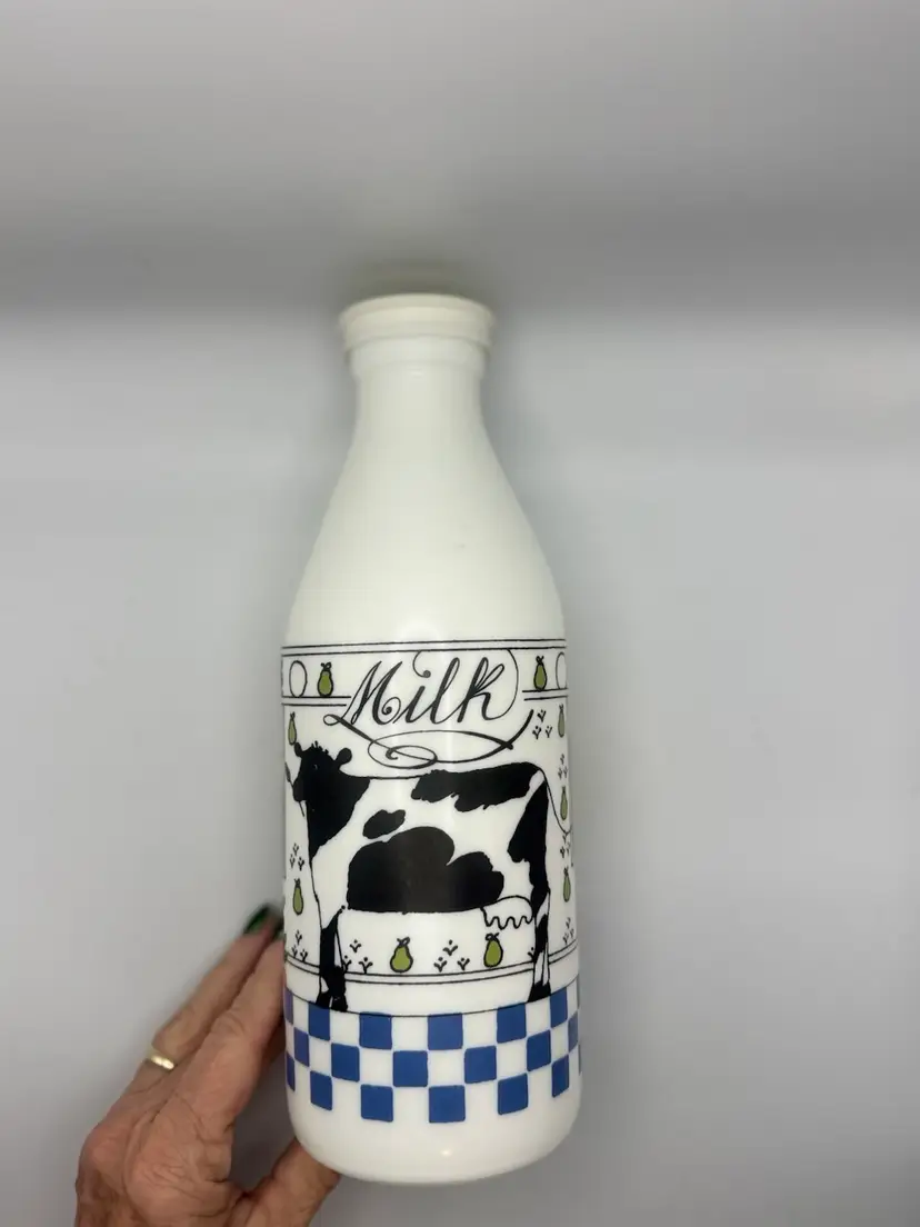 Vintage (1970’s or Early 80’s) milk glass bottle designed by Alan Wood for Lillian Vernon and made in Italy. 10” Marked