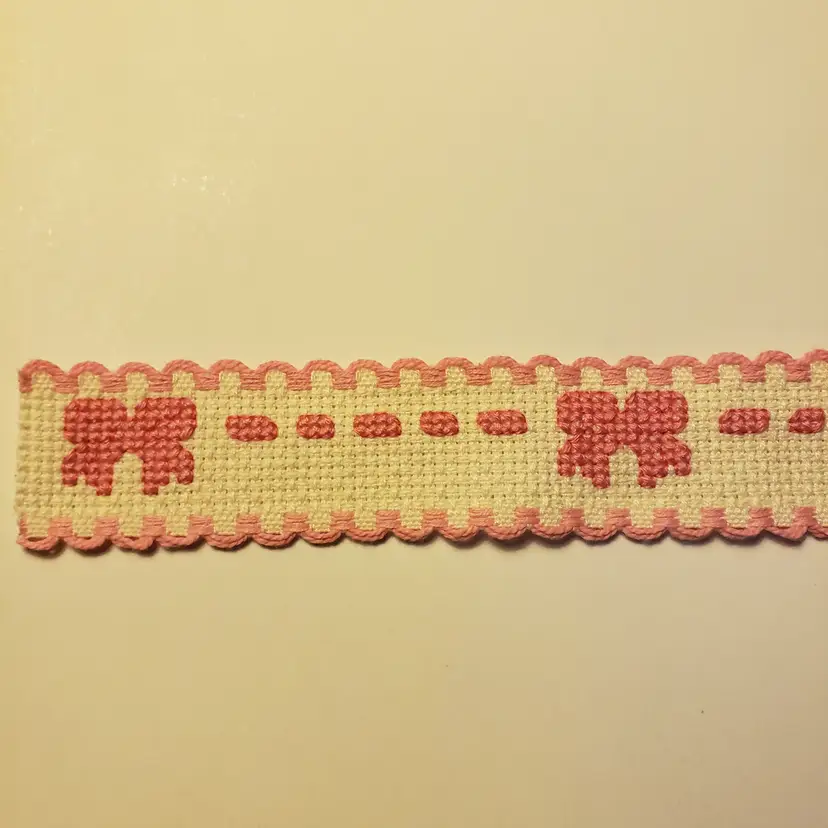 New Cross-stitched Pink Bow and Ribbon cross-stitch pattern on Ivory Ribband
