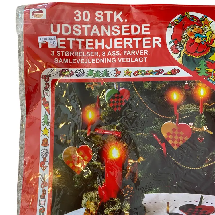 This is a Pobra Heart Basket Paper Kit (No. 6506), which provides pre-cut sheets to make traditional Danish woven hearts (julehjerter). 
The kit includes 30 push-out hearts in 3 sizes and 8 assorted colors.
Danish woven hearts are a traditional Christmas ornament, also popular for Valentine's Day