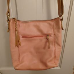 The Sak, salmon colored bag. Body of bag is 100% leather. As shown.