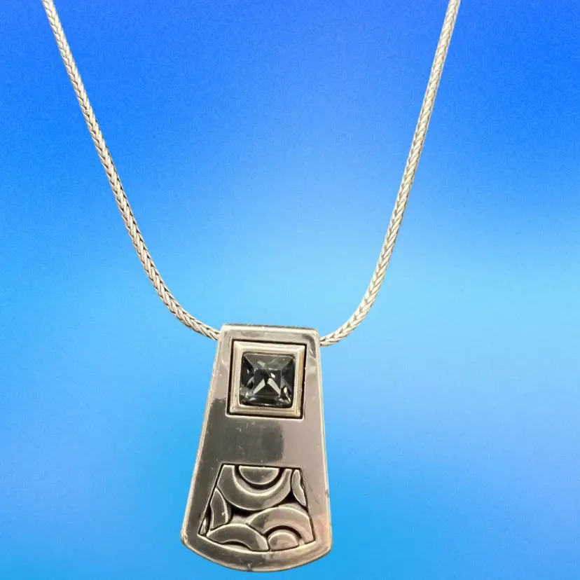 A Brighton Bloc Haus geometric pendant Silver Plated 16-18” necklace with a gray stone.