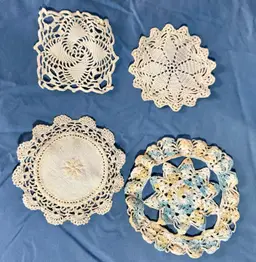 4 Small Doilies