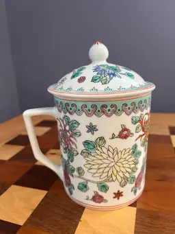 Vintage   porcelain mug with lid, likely of Chinese origin, possibly in the style of Rose Medallion or Famille Rose.
