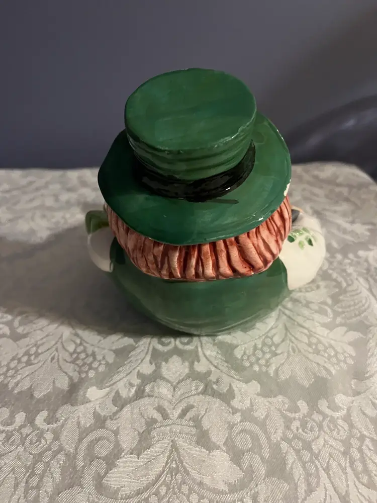 #01 A ceramic leprechaun figurine Bowl  with "100% IRISH" inscription.