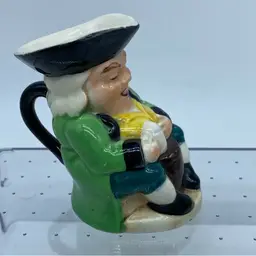 A vintage Burlington Ware ceramic Toby Jug depicting a jovial man with a mug England