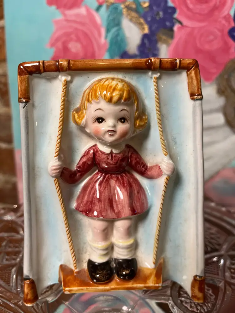 Inarco vintage girl standing on swing planter.  5 inches x 4 inches.