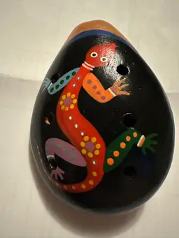 Hand-painted ceramic ocarina whistle with lizard motif, Peruvian folk art.