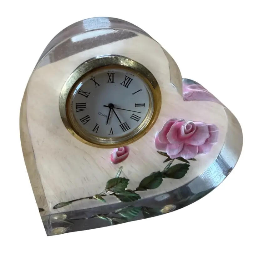 Bircraft heart-shaped clock features a 3D red rose embedded in clear acrylic or Lucite