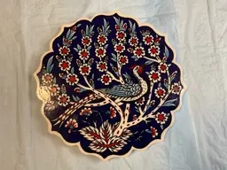 Turkish pottery trivet, peacock and floral design with scalloped edge 7” round