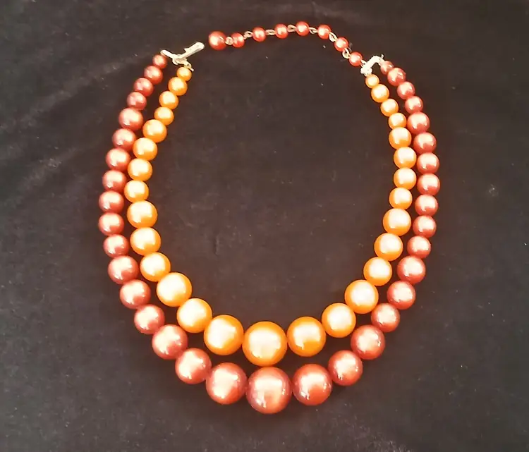 Vintage 1960s Orange Moonglow double strandfaux pearl necklace