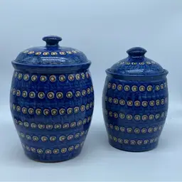 #2254 Pair of blue and yellow hand-painted Polish pottery canisters with lids.