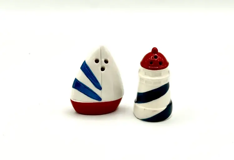 Lighthouse And Sailboat Salt And Pepper Shakers.