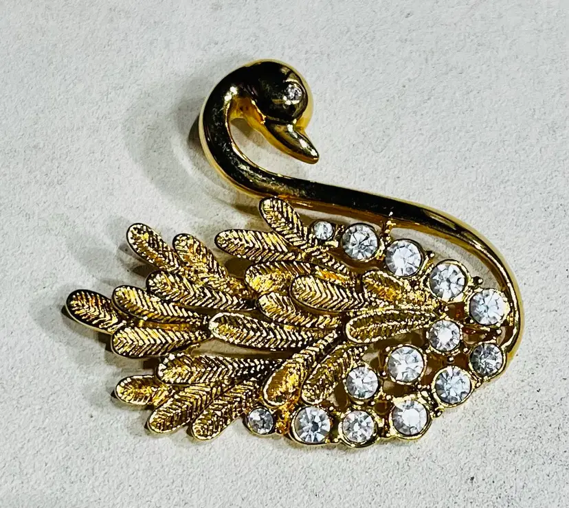 Goldtone Swan brooch With Crystals