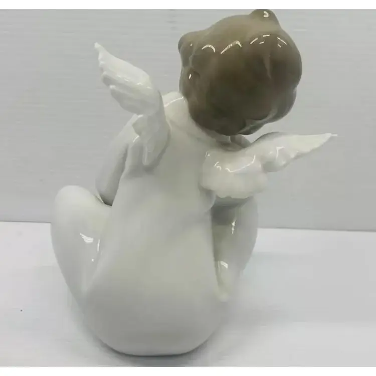 Lladro 1970s Glazed Porcelain " Dreaming Angel" figurine . Retired