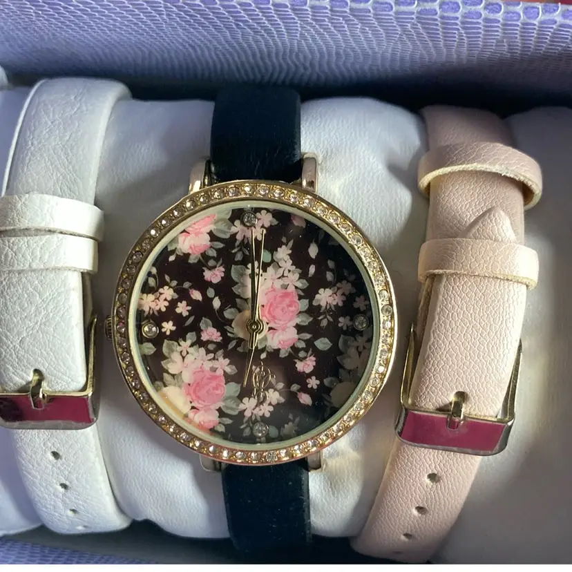 Jaclyn Smith Watch With Interchangeable Bands Pink, White and Black bands.