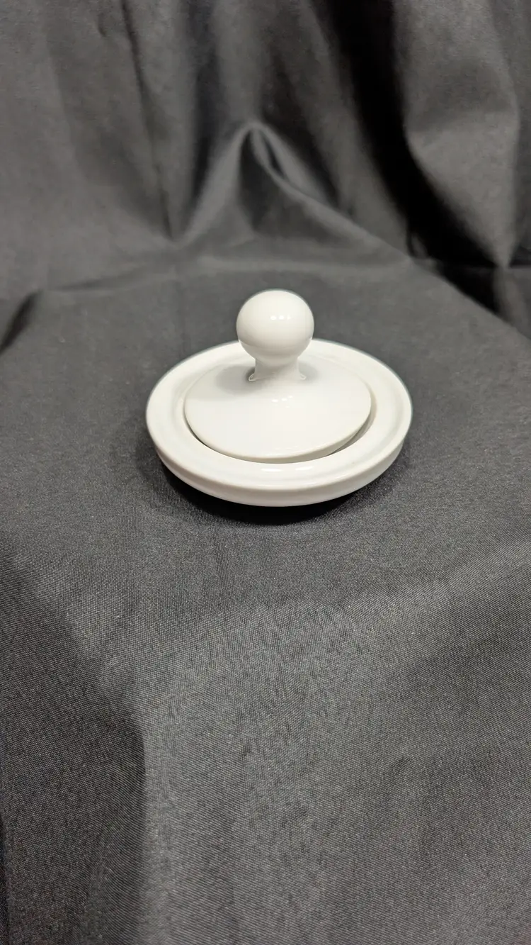 HIC Japan pottery butter press with a white glossy glaze