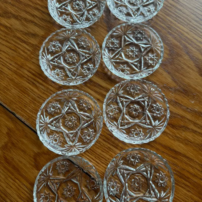 Set of eight vintage Anchor Hocking pressed glass coasters with Star of David pattern.