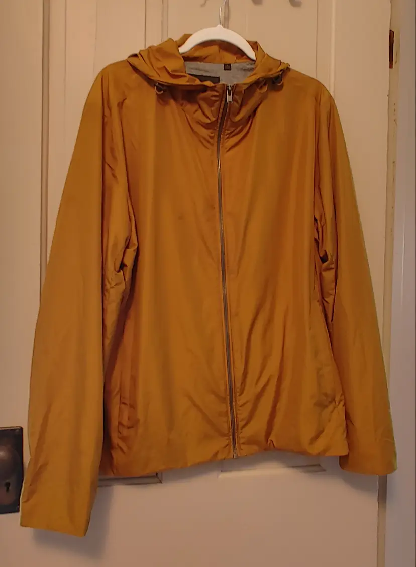 Jacket- Brand: UniGlo. Size Large. Mustard colored zip up jacket. 100% polyester. No callouts.