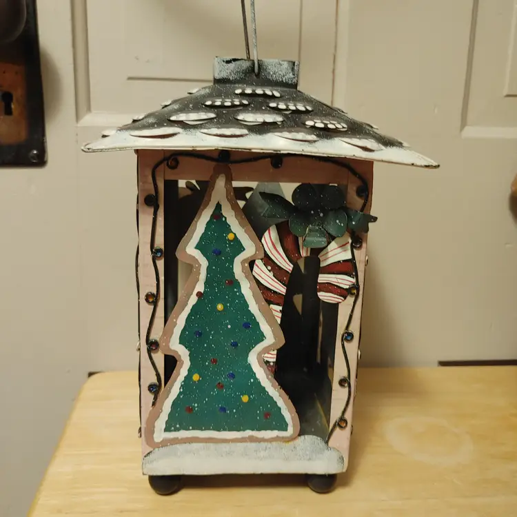 Christmas Lantern. Alternating tree and gingerbread man. Made of metal. 10 inches high.