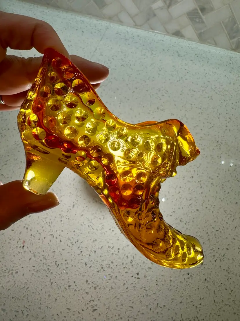Vintage 6” wide 2.75” tall Fenton Art Glass Hobnail slipper shoe, amberina color, featuring a cat head design on the toe.