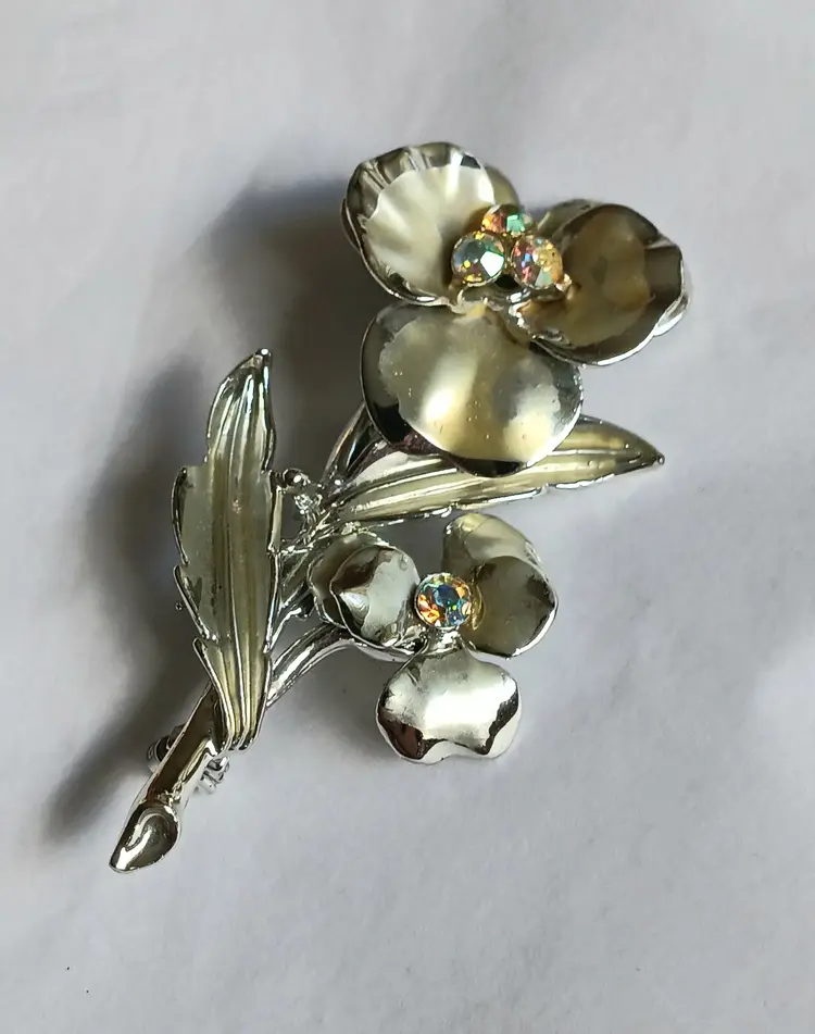 Vintage Silvertone Floral Brooch with Aurora Borealis Rhinestones Coro?