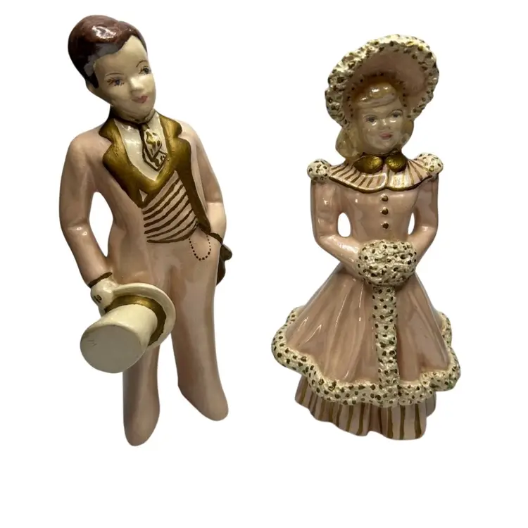 Pink And Gold Chalkware Couple Repair To Ladies Head Some Damage On Gentleman’s Bottom Of Pant Leg
@7x7 1/2” Tall