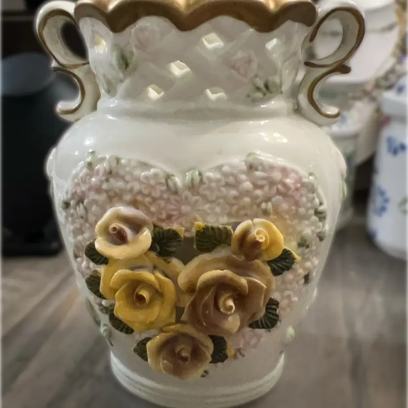 A Capodimonte-style reticulated ceramic vase with applied roses and gold trim.7”x4” Wide, No Chips Or Cracks.