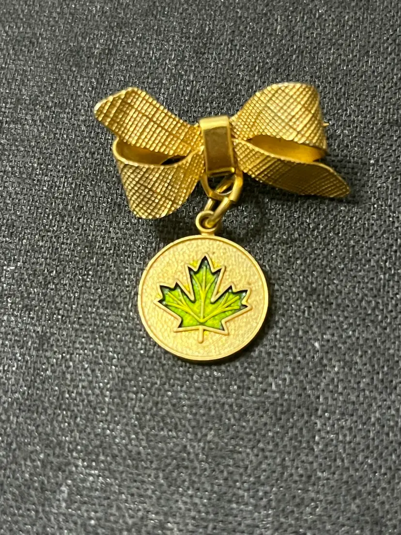 Vintage Goldtone Bow With Dangle Maple Leaf Brooch