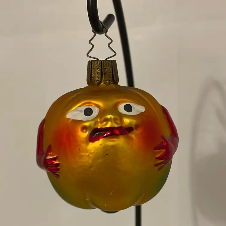 #110 Fruit With Face And Arms Glass Ornament.