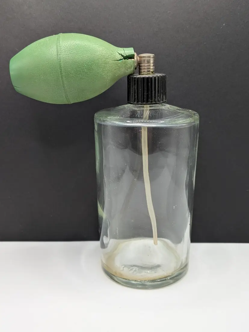 vintage clear glass perfume bottle with a green atomizer bulb AS IS