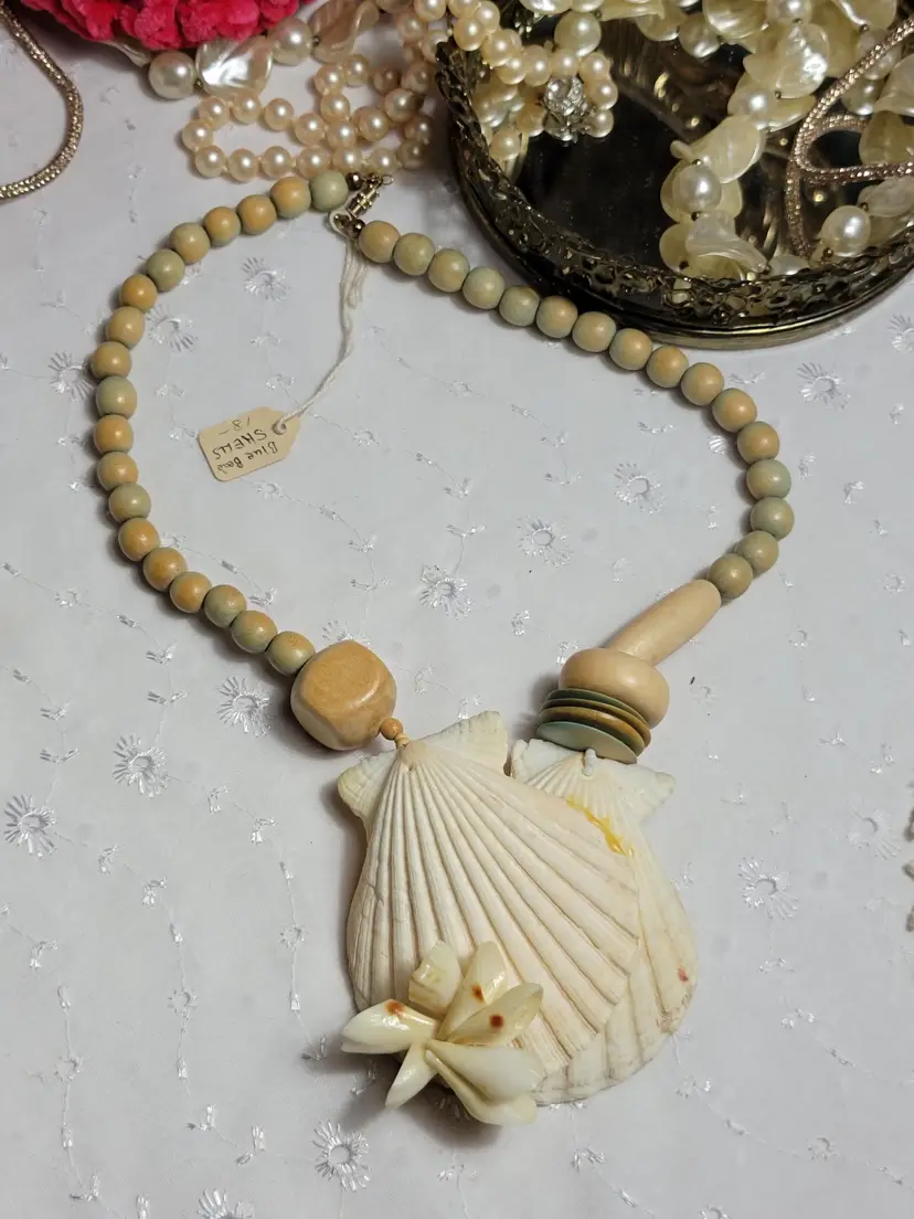 Statement piece clamshell and blue tinted wood bead necklace