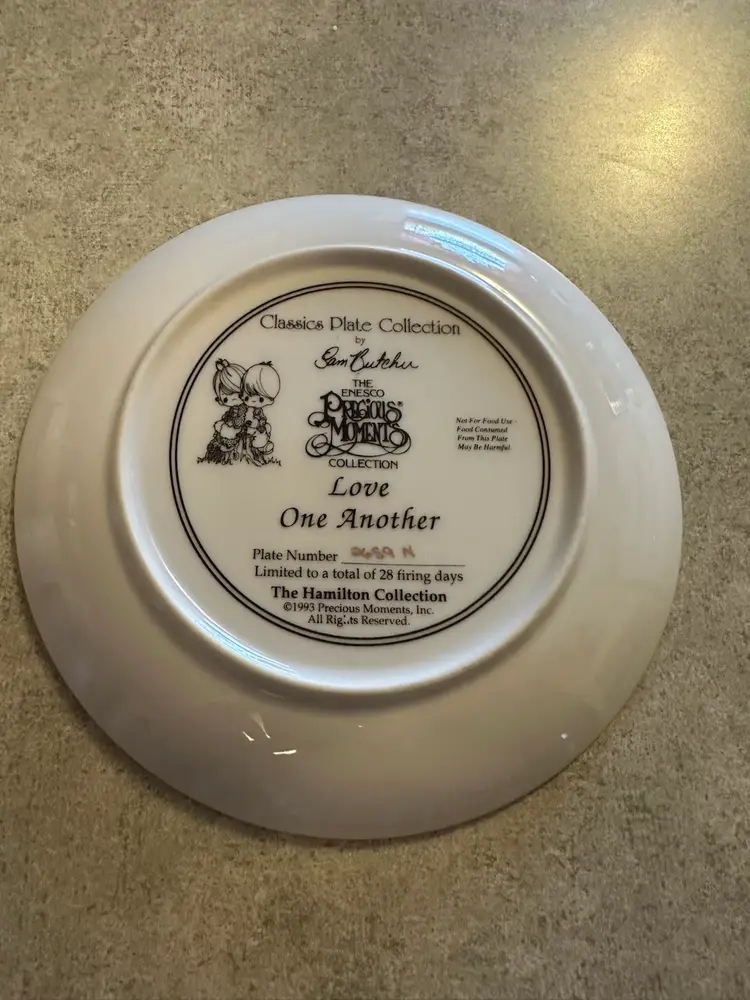Porcelain decorative plate titled 'Love One Another' by Precious Moments