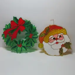 vintage set of 2 plastic stained glass Christmas suncatcher window decor wreath and Santa