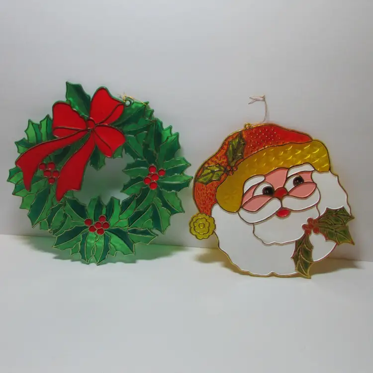 vintage set of 2 plastic stained glass Christmas suncatcher window decor wreath and Santa